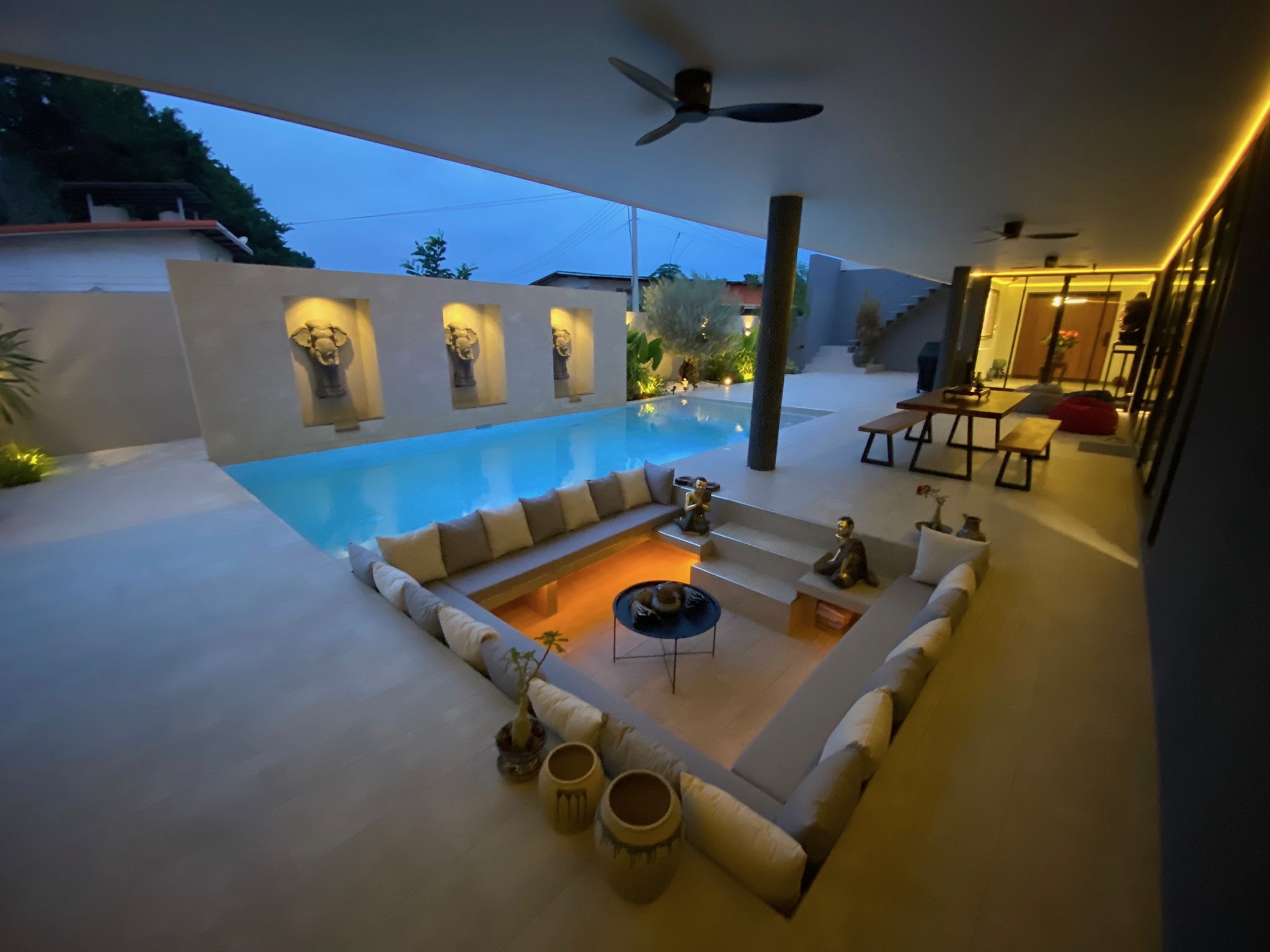 Villa Koh sunken poolside lounge at dusk